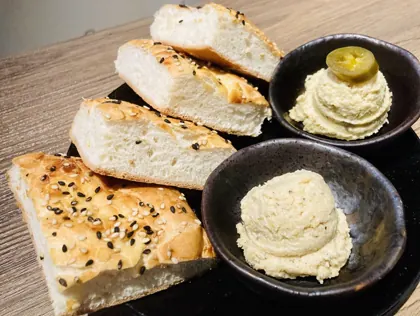 Home made bread with humus and jalapeno humus