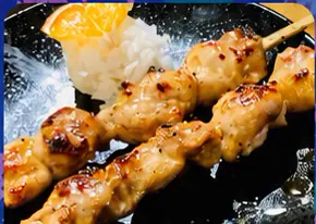 Grilled chicken skewers with rice and house sauce
