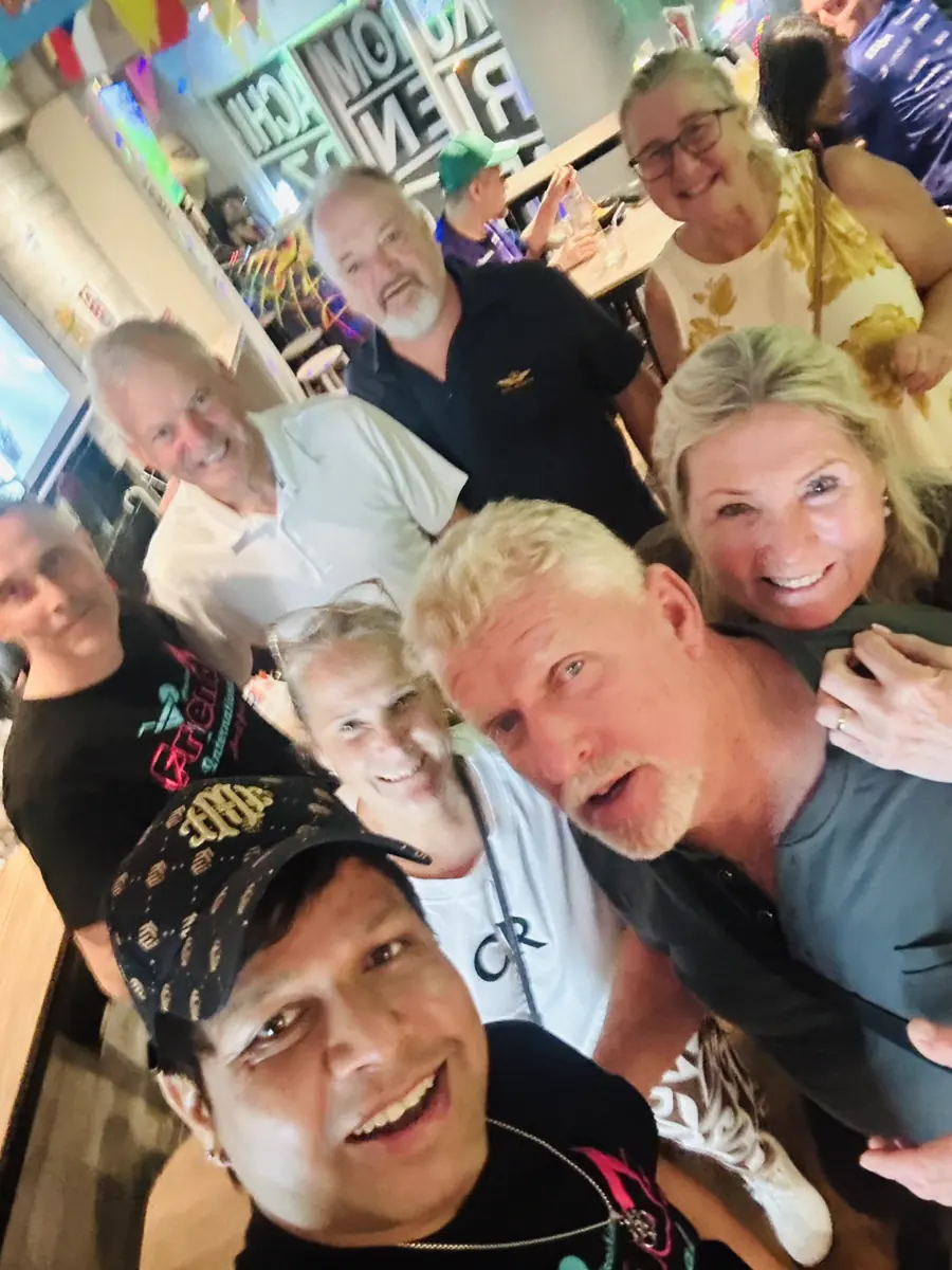 Friends taking a group selfie at Friendz